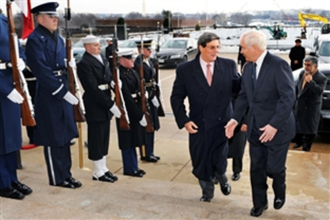 Defense Secretary Robert M. Gates, right, escorts visiting Peruvian Defense Minister Rafael Rey through an honor cordon into the Pentagon, Feb. 17, 2010. The two defense leaders will hold security discussions on a range of mainly regional issues.