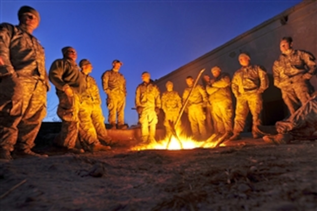 U.S. Army soldiers gather around a fire to stay warm during an operation in Helmand province, Afghanistan, Feb. 14, 2010. The soldiers are assigned to Company A, 1st Battalion, 17th Infantry Regiment.