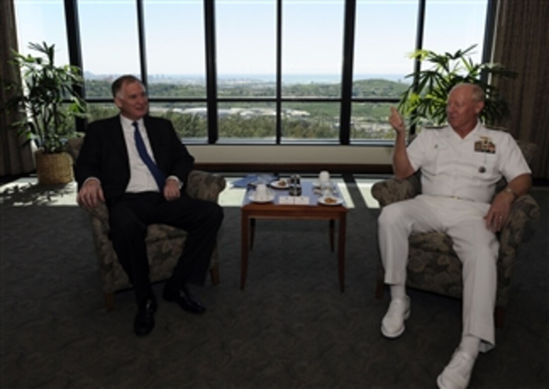 Deputy Secretary of Defense William J. Lynn III talks with the Commander of the U.S. Pacific Command Adm. Robert F. Willard in his office at Camp Smith, Hawaii, on Feb. 16, 2010.  