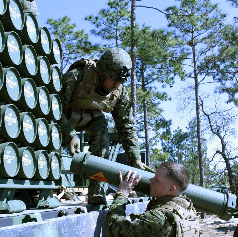 Lance Cpl. Michael J. Gooler, gunner with Fox Battery, 2nd Battalion, 12th Marine Regiment, 2nd Marine Division, grabs a round for the expeditionary fire support M327 120mm towed mortar system aboard Marine Corps Base, Camp Lejeune, N.C., Feb.17, 2010. The unit is third in the Marine Corps to qualify on the system, preparing them for their upcoming attachment to the 26th Marine Expeditionary Unit this fall.