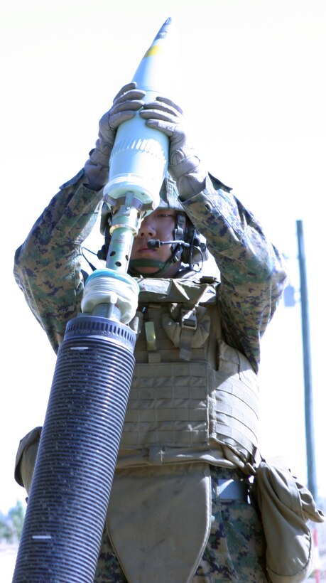 Lance Cpl. Liji Sui, ammunition driver with Fox Battery, 2nd Battalion, 12th Marine Regiment, 2nd Marine Division, preps the expeditionary fire support M327 120mm towed mortar system, as a call-for-fire training mission sounds over the radio aboard Marine Corps Base, Camp Lejeune, N.C., Feb.17, 2010. The unit is third in the Marine Corps to qualify on the system, preparing them for their upcoming attachment to the 26th Marine Expeditionary Unit this fall.