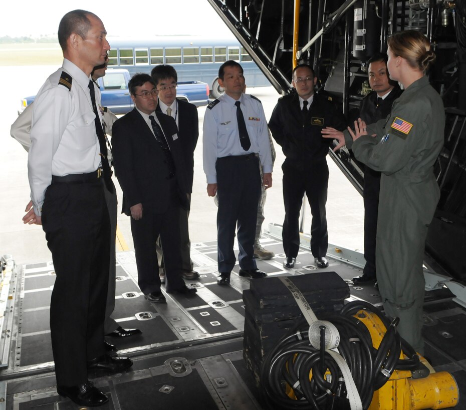 KADENA AIR BASE, Japan -- Staff Sgt. Sarah Hystad, a loadmaster with the 17th Special Operations Squadron, discusses her roles and responsibilities as a loadmaster on a MC-130P Combat Shadow to civilians and officers from Japan's National Institute for Defense Studies here Feb. 17. The officers and civilians visited the 353rd Special Operations Group as part of a bilateral exchange program between the United States and Japan. (U.S. Air Force photo by Tech. Sgt. Aaron Cram)