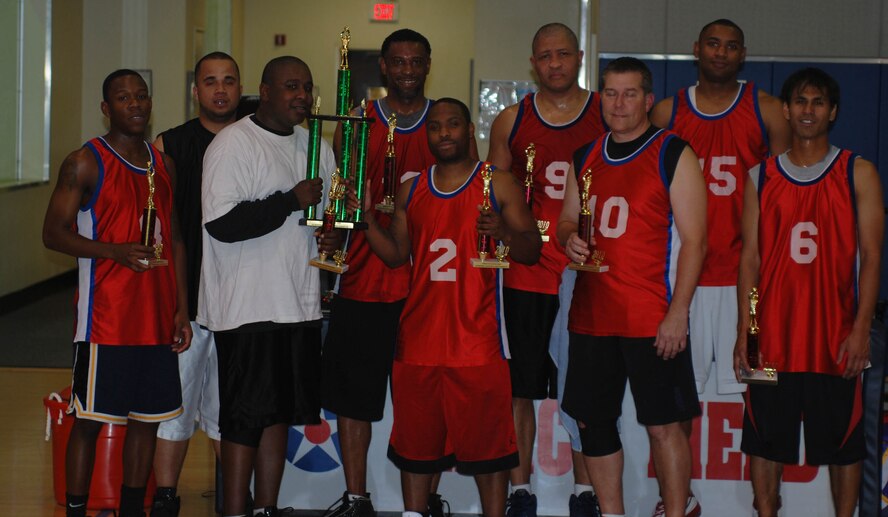 The Comm/ LRS/ 4 AF team accepts the runner- up trophy after the March Air Reserve Base intramural basketball championship game Feb. 16, 2010. (U.S. Air Force photo by Staff Sgt. Kevin Chandler)