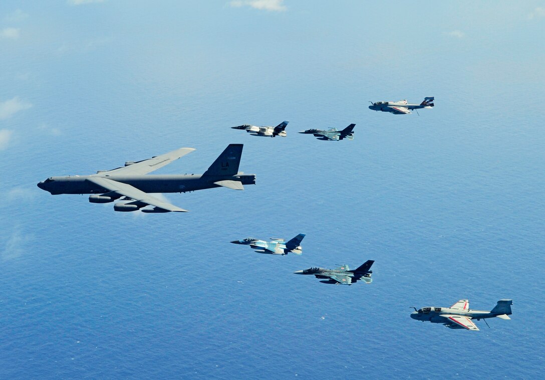 A B-52 Stratofortress leads a formation of two F-16 Fighting Falcons; two Japan Air Self-Defense Force F-2 attack fighters and two U.S. Navy EA-6B Prowlers Feb. 15, 2010 near Guam during Exercise Cope North.  (U.S. Air Force photo/Staff Sgt. Jacob N. Bailey)