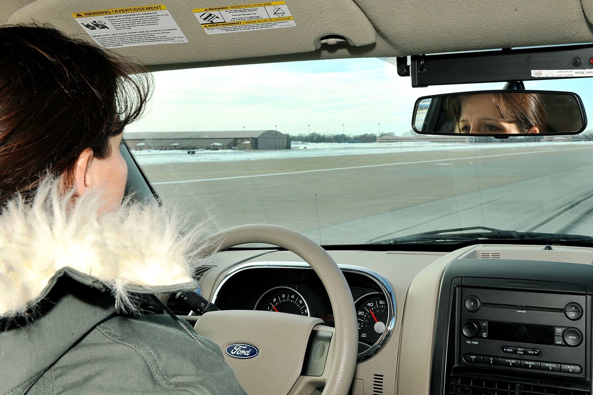 OFFUTT AIR FORCE BASE, Neb. - Senior Master Sgt. Laura Liedke, airfield manager with the 55th Operations Support Squadron, inspects the Offutt runway for any foreign object debris, spalls or areas of damage Feb. 16. The Airfield Operations Flight airfield management team coordinates with various base agencies to provide a safe environment for aircraft operations. 

U.S. Air Force photo by Charles Haymond