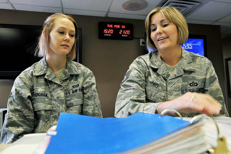 OFFUTT AIR FORCE BASE, Neb. - Airman 1st Class Elise Vaughan and Staff Sgt. Lisa Toro, both with the 55th Operations Support Squadron, look over the notice to airmen binder in base operations for changes concerning the condition of the Offutt airfield Feb.16.  The Airfield Operations Flight airfield management team coordinates with various base agencies to provide a safe environment for aircraft operations. 

U.S. Air Force photo by Charles Haymond