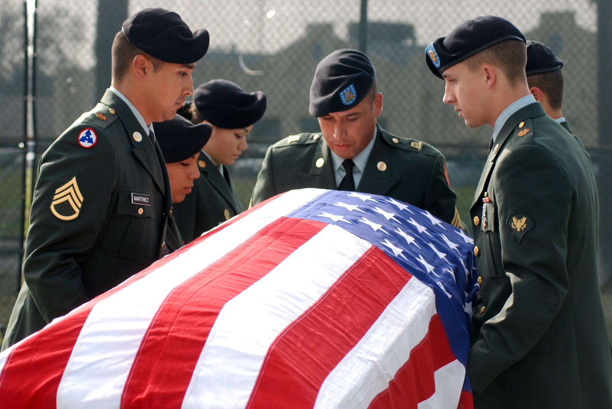 Members of an Army Reserve Honor Guard practice with the Blue Eagles Total Force Honor Guard at March Air Reserve Base, Calif., Feb. 12. The Honor Guard rehearsed a full funeral detail, including flag folding, pallbearing and a firing squad.  (U.S. Air Force photo/Staff Sgt. Megan Crusher)