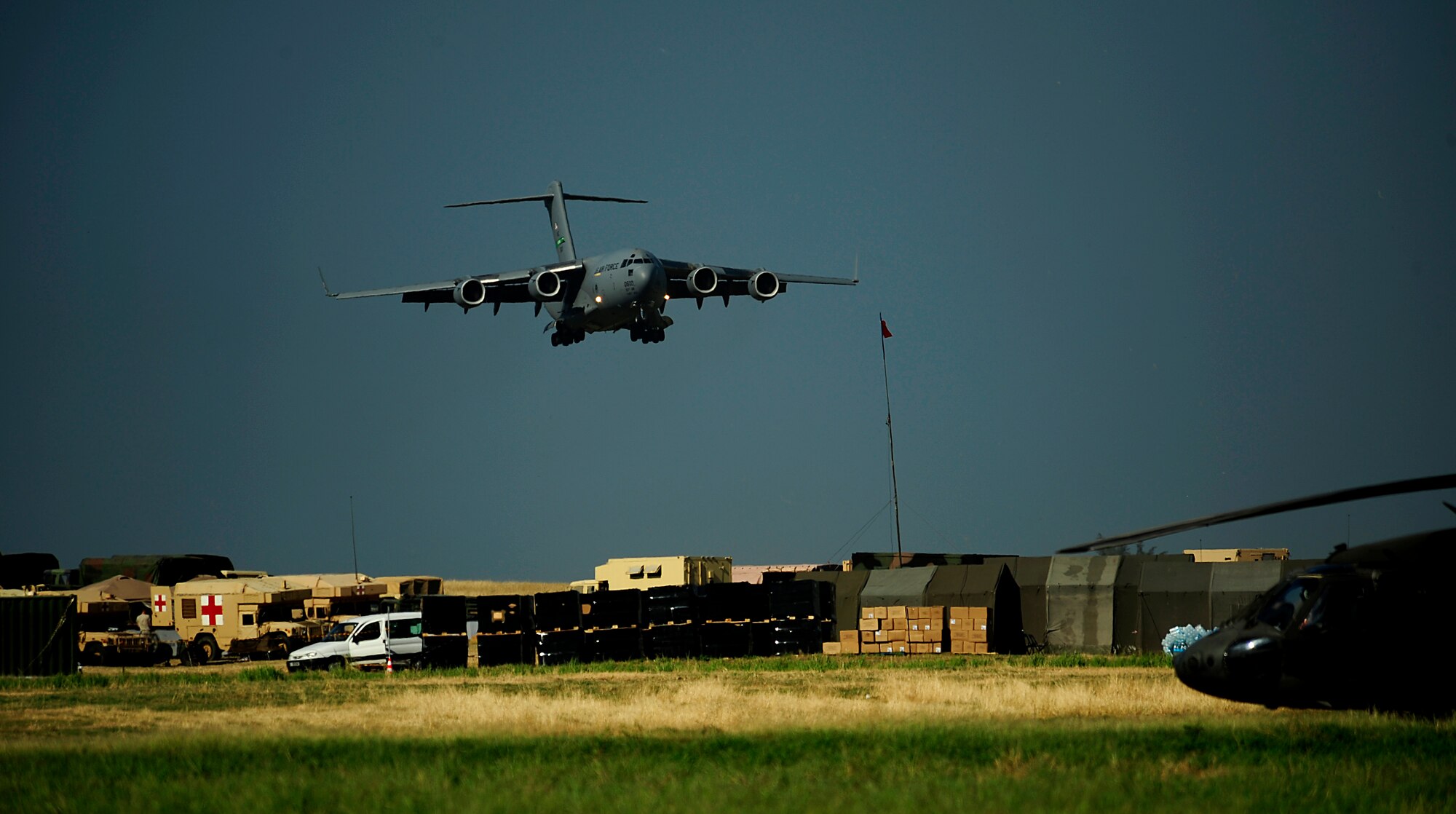 A C-17 Globemaster III from McChord Air Force Base, Wash., lands at the Toussaint L'Ouverture International Airport Jan. 24, 2010, in Port-au-Prince, Haiti. Department of Defense and U.S. Agency for International Development officials are conducting relief efforts in the area following a 7.0-magnitude earthquake that struck the region Jan. 12, 2010. (U.S. Air Force photo/Tech. Sgt. James L. Harper Jr.)
