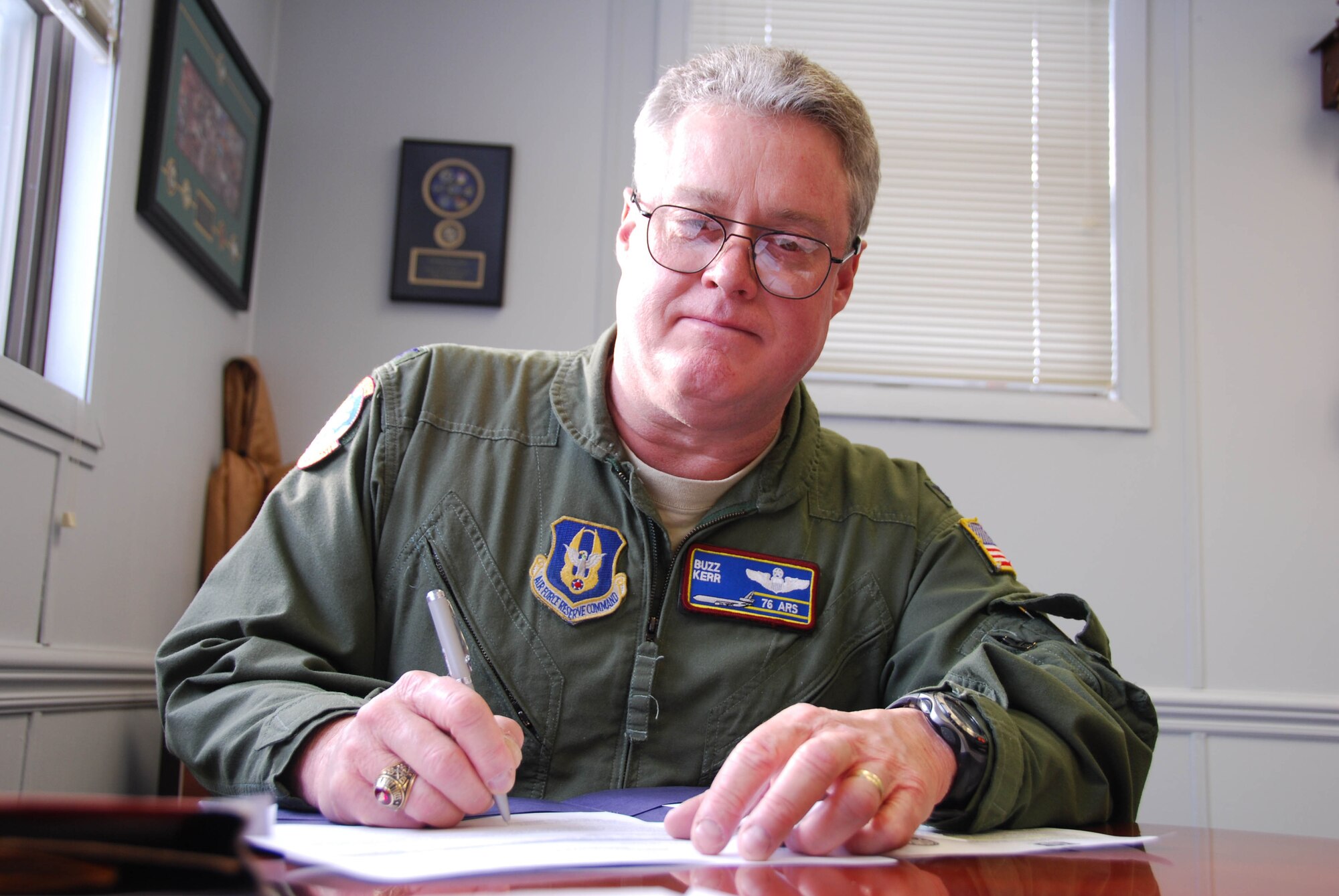 JOINT BASE MCGUIRE-DIX-LAKEHURST, N.J. - Col. James L. Kerr signs paperwork during his final week as Reserve commander of the 514th Air Mobility Wing, here. (U.S. Air Force photo/Master Sgt. Donna T. Jeffries) 