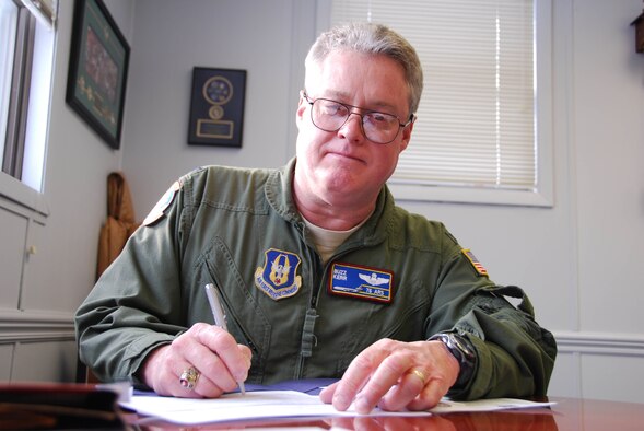 JOINT BASE MCGUIRE-DIX-LAKEHURST, N.J. - Col. James L. Kerr signs paperwork during his final week as Reserve commander of the 514th Air Mobility Wing, here. (U.S. Air Force photo/Master Sgt. Donna T. Jeffries) 