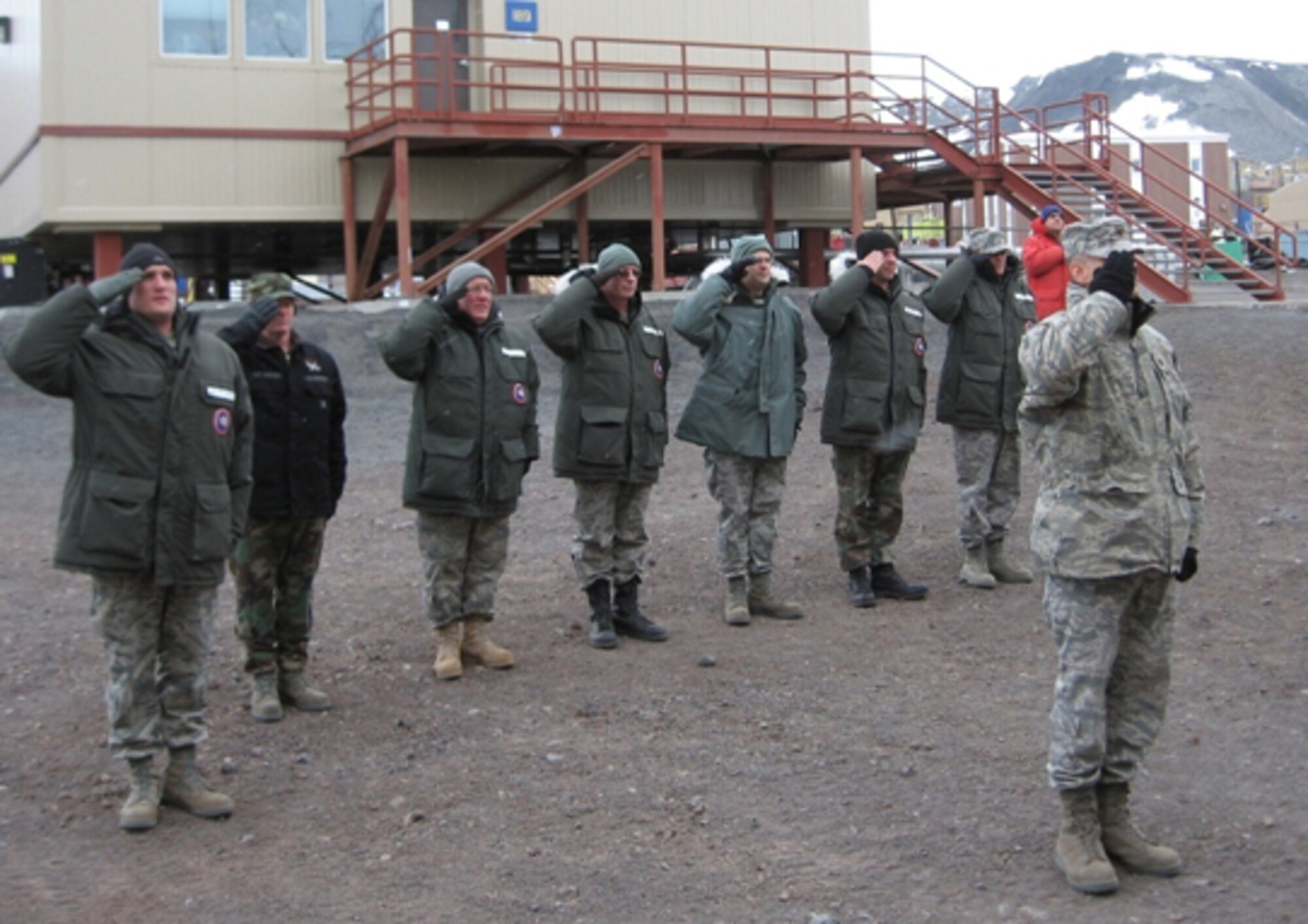 Maj. Jeff Hedges, Joint Task Force Support Forces Antarctica executive officer, leads Airmen at McMurdo Station, Antarctica, during a retreat ceremony Feb. 16 following the departure of the last LC-130 Hercules from the continent.  The 2009-2010 season of Operation Deep Freeze, the Department of Defense’s logistical support to the National Science Foundation and U.S. Antarctic Program in Antarctica, is wrapping up as personnel re-deploy from Antarctica and New Zealand.  JTF SFA, headquartered at Joint Base Pearl Harbor Hickam, Hawaii, and led by 13th Air Force, coordinated ODF operations. (Courtesy photo)