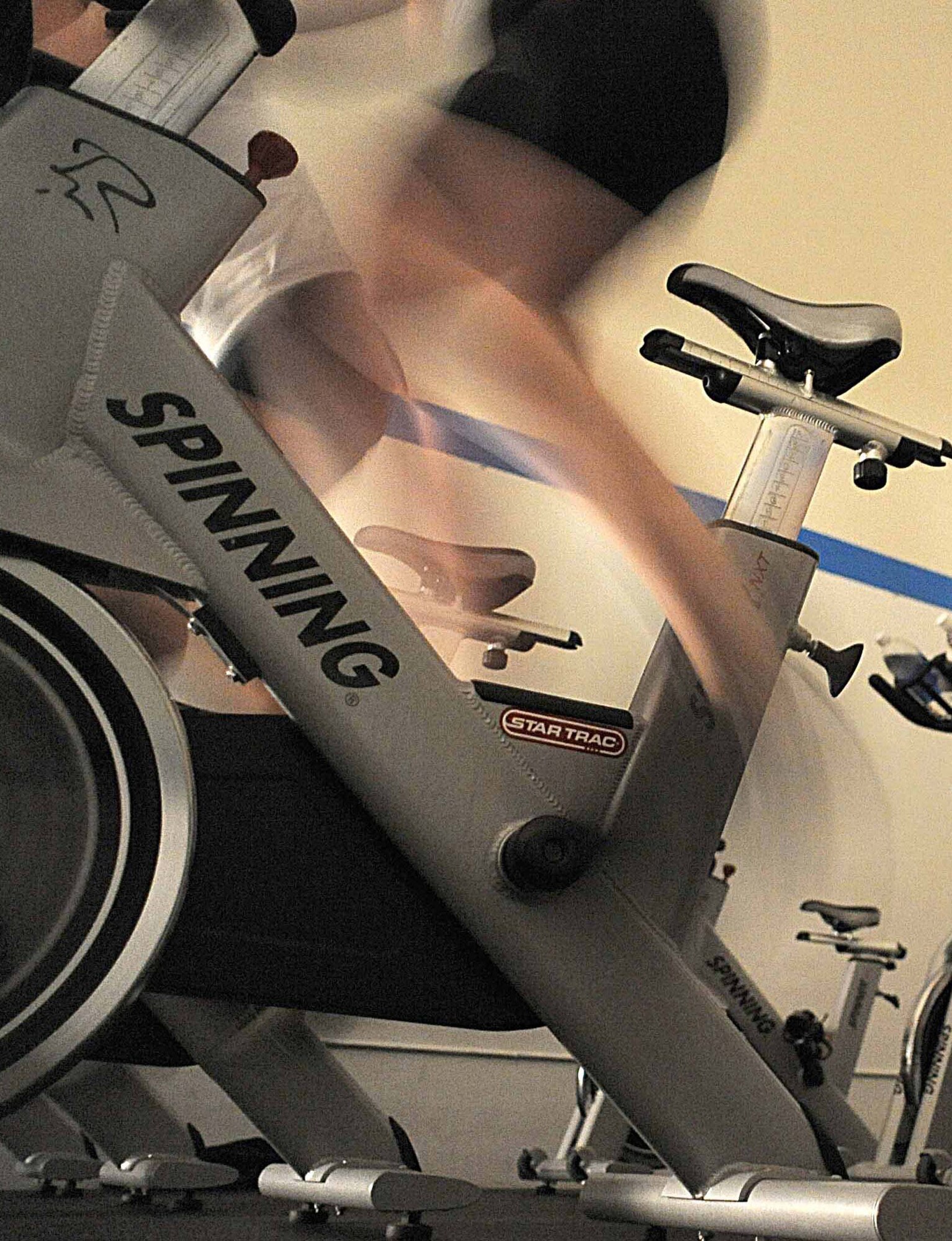 A participant in the Wednesday Hump Day Spin-A-Thon at Cannon Air Force Base, N.M., spins for health. The two-hour event tests fitness and endurance. and participants 3earn a T-shirt for their efforts. (U.S. Air Force Photo by Senior Airman Evelyn Chavez)