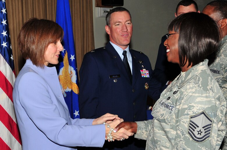 Master Sgt. Marcia Scantlebury-Hall of the 45th Force Support Squadron (right) shakes hands with Col. Ed Wilson’s wife, Lisa, at the reception following the change of command ceremony. (U.S. Air Force photo by Jennifer Macklin)