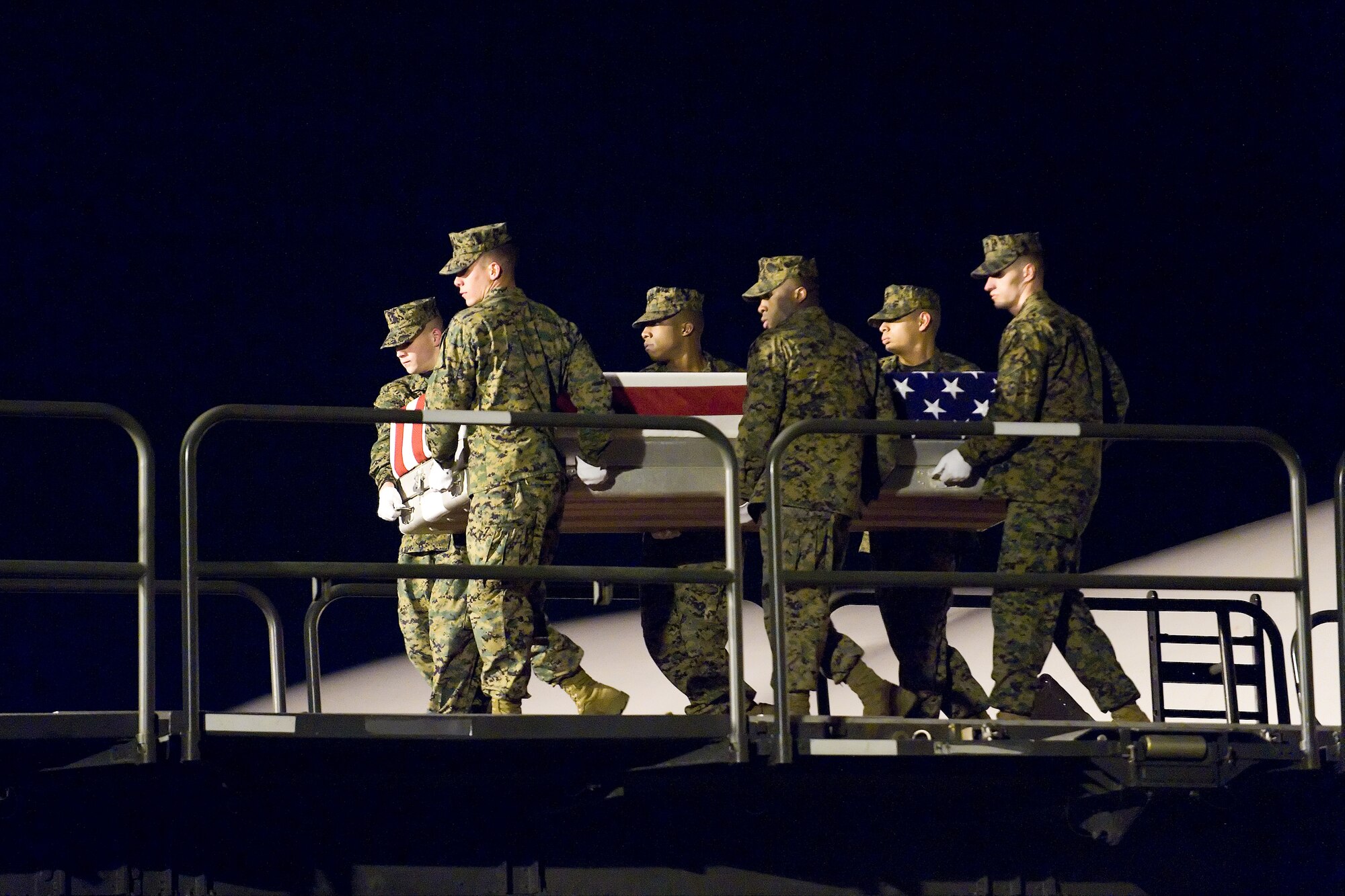 A U.S. Marine Corps team transfers the remains of Marine Corps Pfc. Jason H. Estopinal, of Dallas, Ga., at Dover Air Force Base, Del., February 17. Pfc. Estopinal was assigned to 2nd Battalion, 2nd Marine Regiment, 2nd Marine Division, II Marine Expeditionary Force, Camp Lejeune, N.C. (U.S. Air Force photo/Roland Balik)