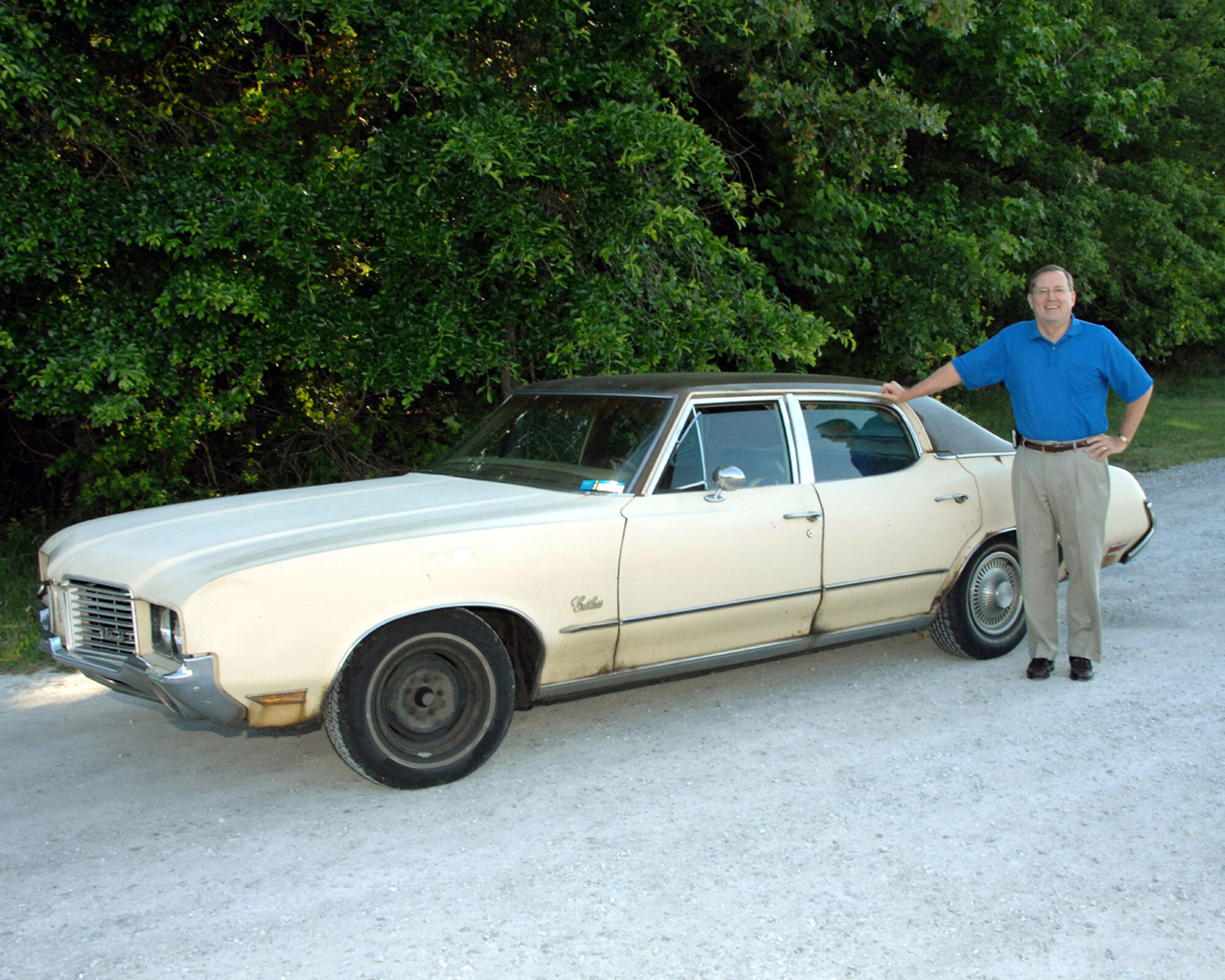 For those that know Temple Bowling and his rusty 1972 Olds, it was one of his pride and joys. Here, Bowling poses with it for one of the last times before selling it a couple of years ago for just $300. The car had more than 374,000 miles accumulated on it. (Photo by David Housch)
