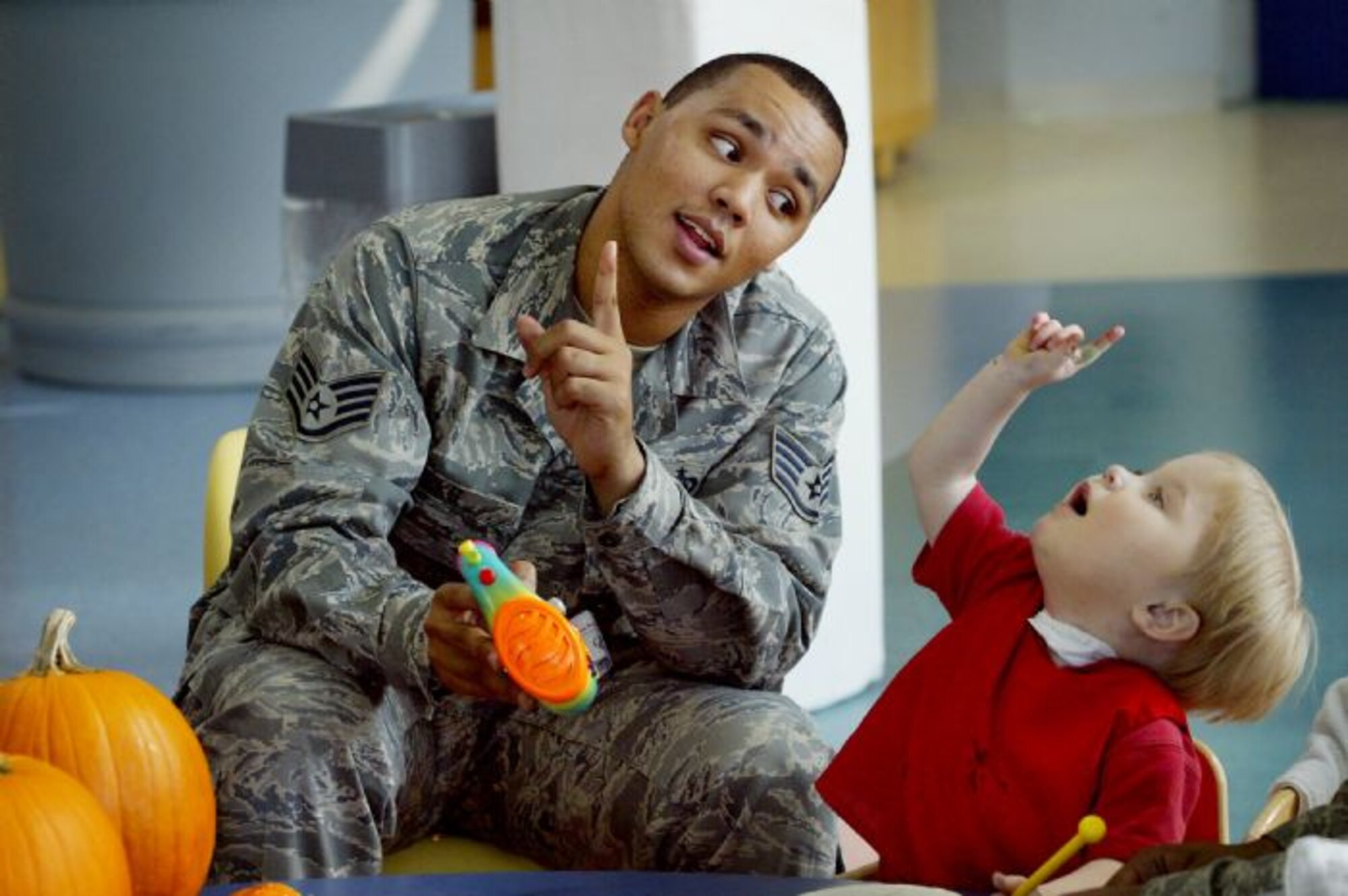 Staff Sgt. Jewell Hicks, 13th Intelligence Squadron imagery analyst, interacts with a child at Ranken Jordan Pediatric Hospital, Ill. during his days at Scott Air Force Base. Sergeant Hicks' Airmen for Children program has recently been established at Beale to help children in Sacramento. (Courtesy photo)