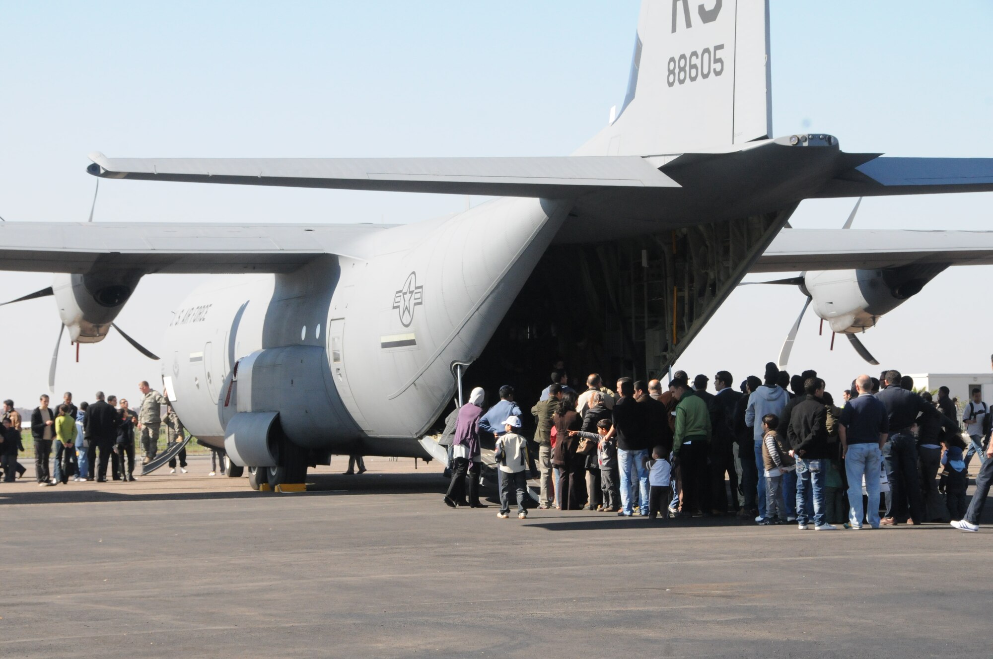 Visitors at the Marrakech Aeroexpo 2010 wait in line to view the inside of a C-130J Super Hercules from the 37th Airlift Squadron, 86th Airlift Wing, Ramstein Air Base, Germany, Jan. 30. The Aeroexpo involved static displays of the C-130J, two F-16s from the 169th Fighter Wing, South Carolina ANG; and a KC-135 Stratotanker from the 151st Air Refueling Wing, Utah ANG. (U.S. Air Force photo by Staff Sgt. Stefanie Torres)