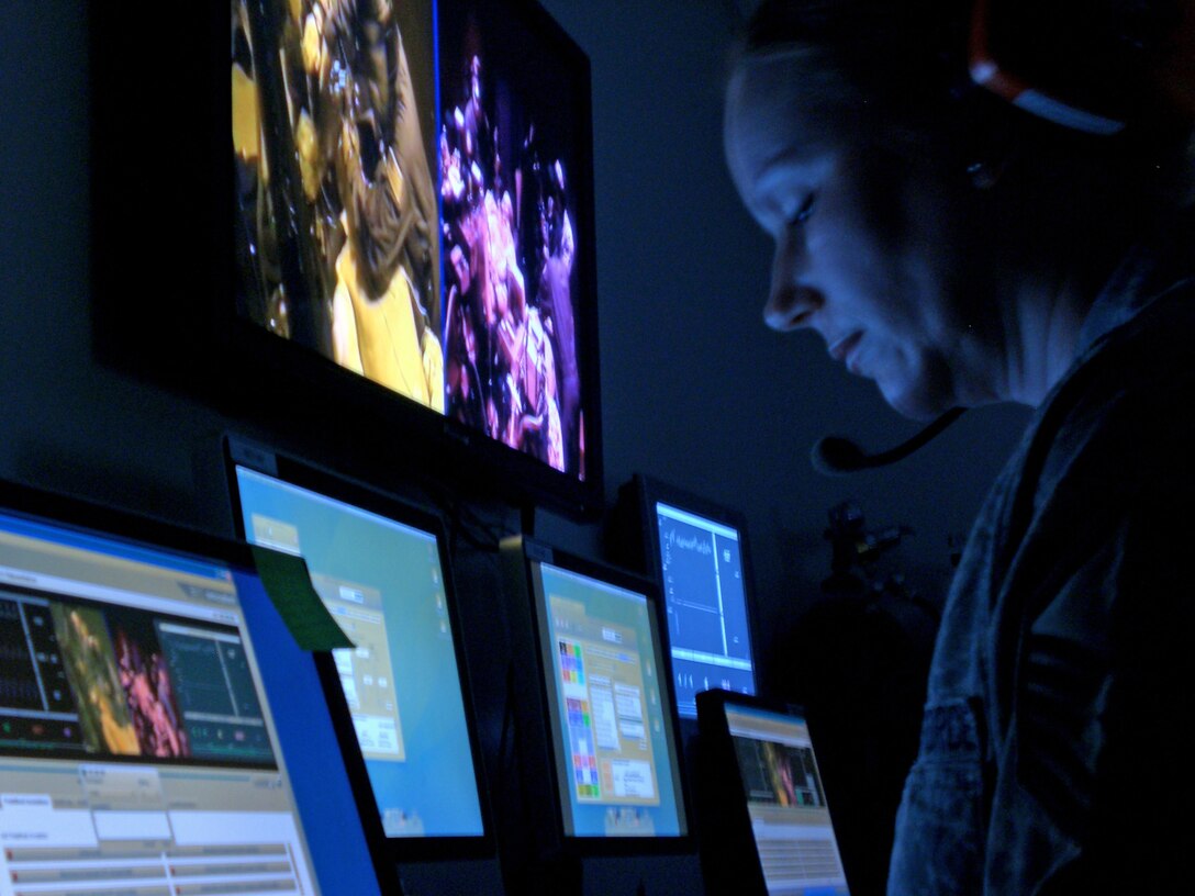 Master Sgt. Angelique Boshonek operates the human patient simulator from a control room Feb. 12, 2010, at University Hospital Cincinnati in Cincinnati, Ohio. The facility provides highly realistic training for critical care air transport teams and simulates an Air Force airlifter in flight. Sergeant Boshonek is a cardiopulmonary technician and part of the training cadre for the Air Force's Centers for Sustainment of Trauma and Readiness Skills at University Hospital. (U.S. Air Force photo/Derek Kaufman) 