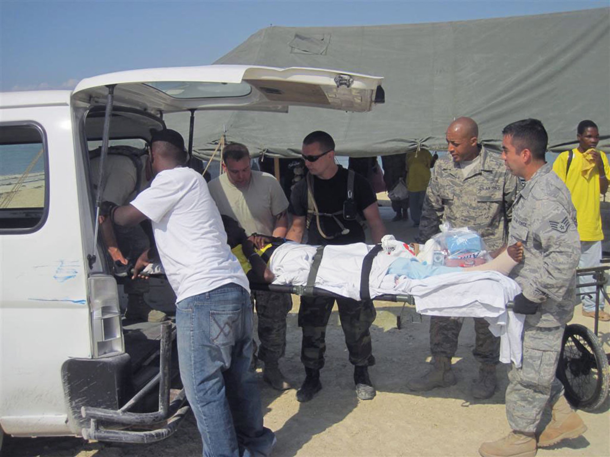 (From left to right) DICE team members Tech. Sgt. Turvon Casey, Senior Airman Travis Meyer and Staff Sgt. Jon Hutchins help load patients from the USNS Comfort for transport to the 24th Expeditionary Medical Support unit. Courtesy photo 