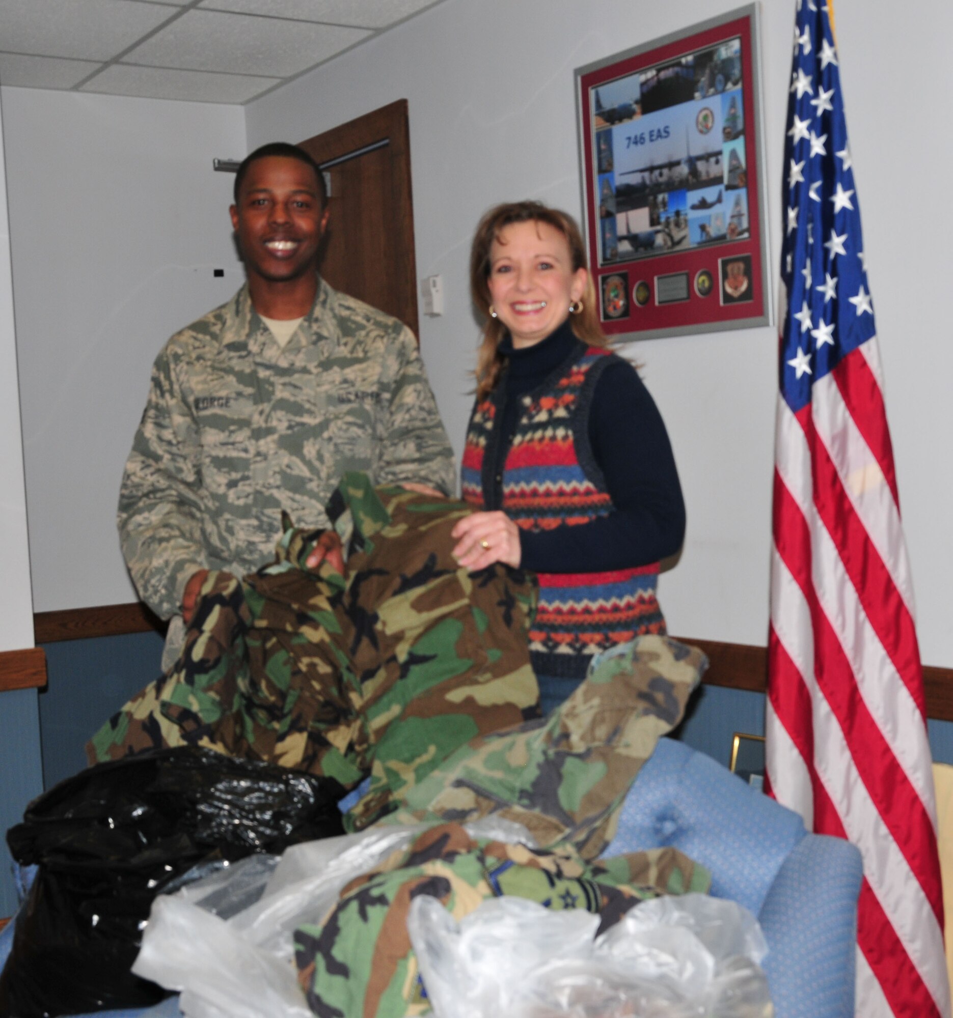 Senior Airmen Christopher George of the 914 Airlift Wing Raising 6 Organization presents 1st Lt. Tina Warnock of the Civil Air Patrol,TAC Composite Squadron with surplus military uniforms donated by unit members.The CAP was on base for the Western New York Group Leadership Development school that brings over100 CAP Cadets from units all over New York State to Niagara for a full weekend of leadership classes and exercises. 1st Lt. Warnock stated that cadets as young as 12 years old join the Civil Air Patrol, which is an auxiliary of the Air Force and are required to buy their own uniforms. Any donation of uniform items is appreciated as some do not have the resources to purchase their own uniforms. ( U.S Air Force photo by Staff Sgt. Everett Myrick)