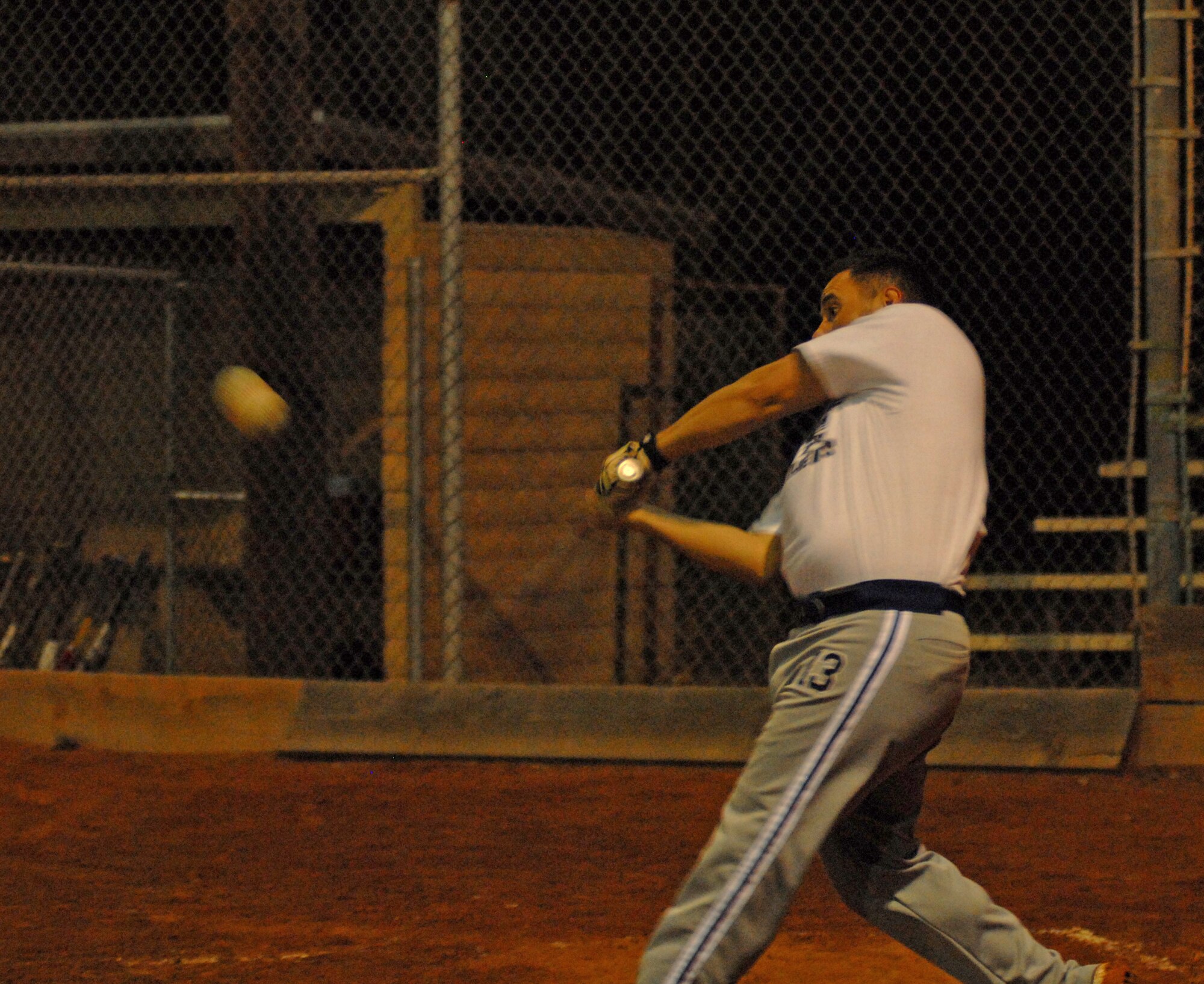 VANDENBERG AIR FORCE BASE, Calif. -- Hitter Tyler Master, a member of the 30th Space Communications Squadron softball team, swings with intense force during a practice game against the Army Prison Guards at the base softball field here Tuesday, Feb. 16, 2010. Winter softball season runs January through March. (U.S. Air Force photo/Airman 1st Class Kerelin Molina)
