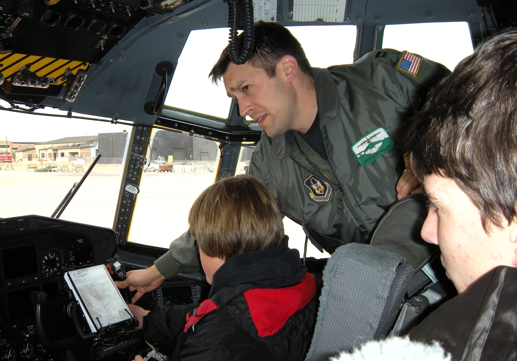 Capt. Brian McReynolds, an Air Force Reserve C-130 pilot assigned to the 302nd Airlift Wing, shows students from the Colorado Springs School Feb. 17 instrumentation used to fly the C-130 Hercules at Peterson Air Force Base, Colo. The students, who are enrolled in an aviation studies course, visited the 302nd AW to learn more about practical uses of aircraft and the C-130. The students are from Colorado Springs, Colo. (U.S. Air Force photo/Rebekah Williamson)