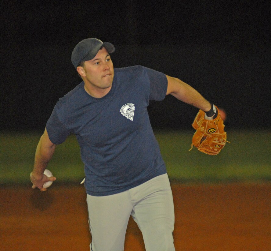 VANDENBERG AIR FORCE BASE, Calif. -- Thomas Giddings, a member of the 30th Space Communications Squadron softball team, prepares to pitch during a practice game against the Army Prison Guards at the base softball field here Tuesday, Feb. 16, 2010. Winter intramural softball season runs January through March. (U.S. Air Force photo/Airman 1st Class Kerelin Molina)
