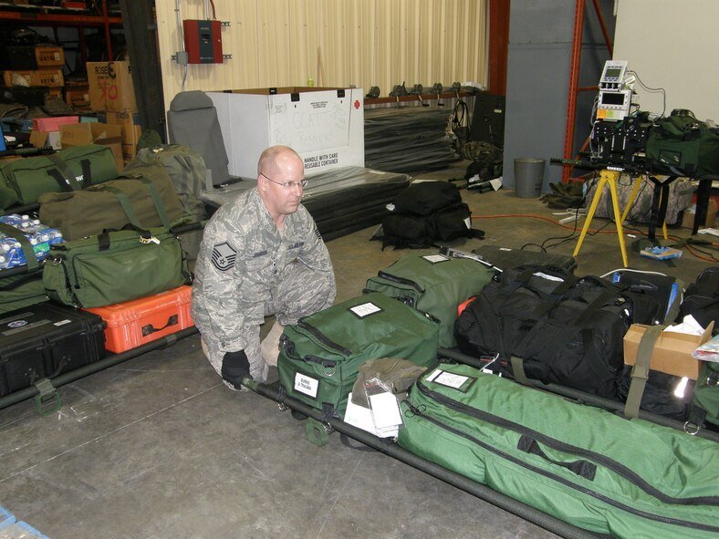 WRIGHT-PATTERSON AIR FORCE BASE, Ohio – Master Sgt. Jerry Johnson, 445th Aeromedical Evacuation Squadron, loads equipment to be used for a future AE mission in support of Operation Unified Response. The 445th AES sent a five-person crew consisting of two flight nurses and three AE technicians; and three AE ground crew members to MacDill Air Force Base to support the on-going relief efforts in Haiti. (Courtesy photo)