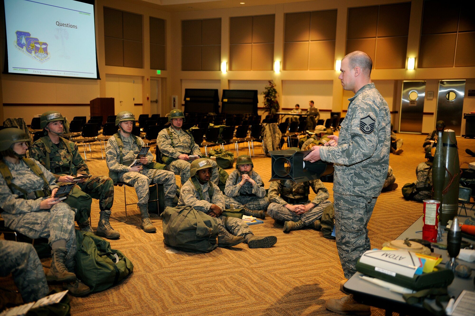 BUCKLEY AIR FORCE BASE, Colo. Airmen refresh their knowledge of different types of explosives during Ability to Survive and Operate training Jan. 25. More than 130 Buckley Airmen attended the class, which taught unexploded ordnance recognition, post-attack reconnaissance, weapons familiarizations, self aid and buddy care, chemical protection techniques and personnel decontamination techniques. (U.S. Air Force photo by Staff Sgt. Steve Czyz)