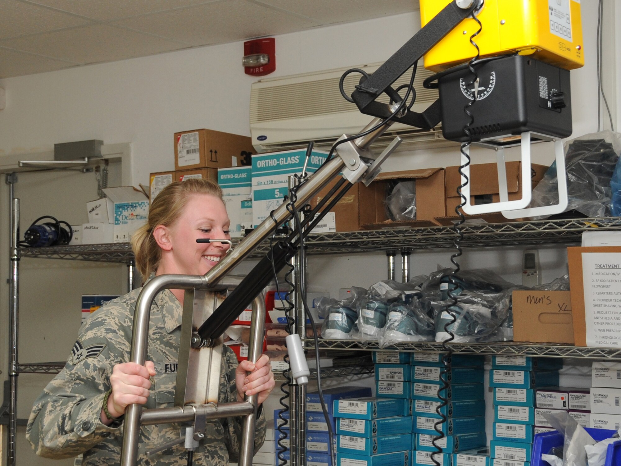 Senior Airman Shara Fuentes, 380th Expeditionary Wing Medical Group medical technician sets up an x-ray at an undisclosed location in Southwest Asia on Feb 15, 2010. The 380th AEW is comprised of four groups and 12 squadrons and the wing's deployed mission includes air refueling, surveillance, and reconnaissance in support of overseas contingency operations in Southwest Asia. The wing supports Operation Iraqi Freedom, Operation Enduring Freedom and the Combined Joint Task Force-Horn of Africa. (U.S. Air Force photo/Senior Airman Jenifer H. Calhoun/Released)
