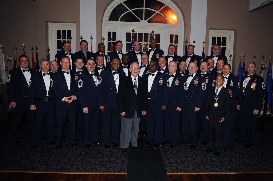 Seymour Johnson's Chief's Group and special guests pose for a photo after the Chief Recognition Ceremony on Seymour Johnson Air Force Base, N.C., Feb. 13, 2010. The ceremony recognized the achievements of seven senior non-commissioned officers selected for promotion to the top enlisted rank of chief master sergeant. (U.S. Air Force photo/Senior Airman Ciara Wymbs) 