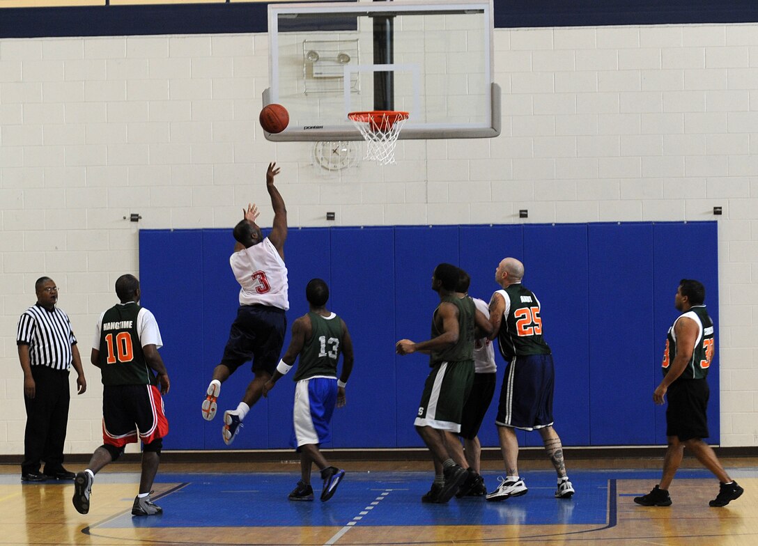 LANGLEY AIR FORCE BASE, Va. -- Air Combat Command/A-1 Guard Demarcus Tate takes the ball to the hoop Feb. 17, in a game against the Ryan Center at the Shellbank Fitness Center. It was a close game for Over 30 basketball league teams, but ACC/A-1 upset the Ryan Center by one point, 47-46.  (U.S. Air Force photo/Senior Airman Zachary Wolf)
