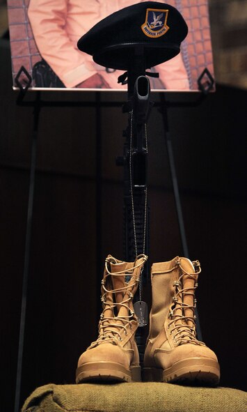 MOODY AIR FORCE BASE, Ga. -- A pair of boots, an M-16 rifle, dog tags and a beret sit on top of an altar, symbolizing a fallen solider during a memorial service  here Feb. 13. The memorial service was for Staff Sgt. David Horney and Senior Airman Chad Rice, 824th Security Forces Squadron, who were both posthumously presented with an Air Force Commendation Medal. (U.S. Air Force photo by Airman 1st Class Joshua Green)
