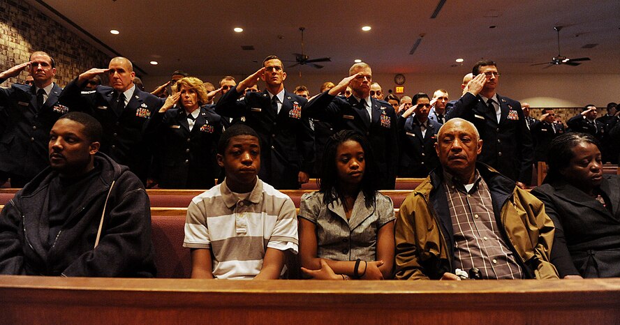 MOODY AIR FORCE BASE, Ga. -- Family members of Senior Airman Chad Rice, 824th Security Forces Squadron, listen as the final roll call for their fallen family member is announced during a memorial service here Feb. 13. It is a tradition and an honor for the 824th SFS to make the final call representing accountability for those members within that squadron. (U.S. Air Force photo by Airman 1st Class Joshua Green)
