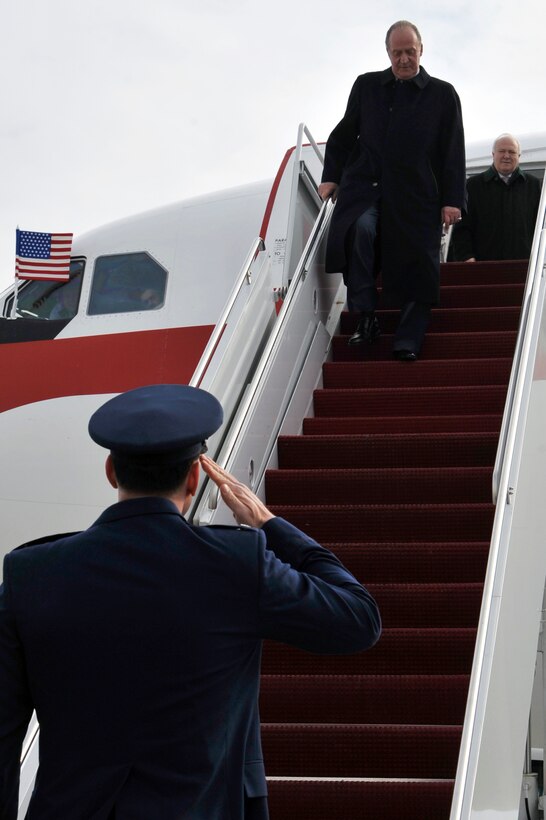 Colonel Steven Shepro, 316th Wing/Joint Base Andrews commander salutes as Juan Carlos, king of Spain, steps off a Spanish Air Force Airbus A310 Feb. 17, 2010 at Joint Base Andrews, Md. Andrews is a hub for any distinguished visitor arriving in the National Capital Region due to its added security. (U.S. Air Force photo by Airman 1st Class Perry Aston)