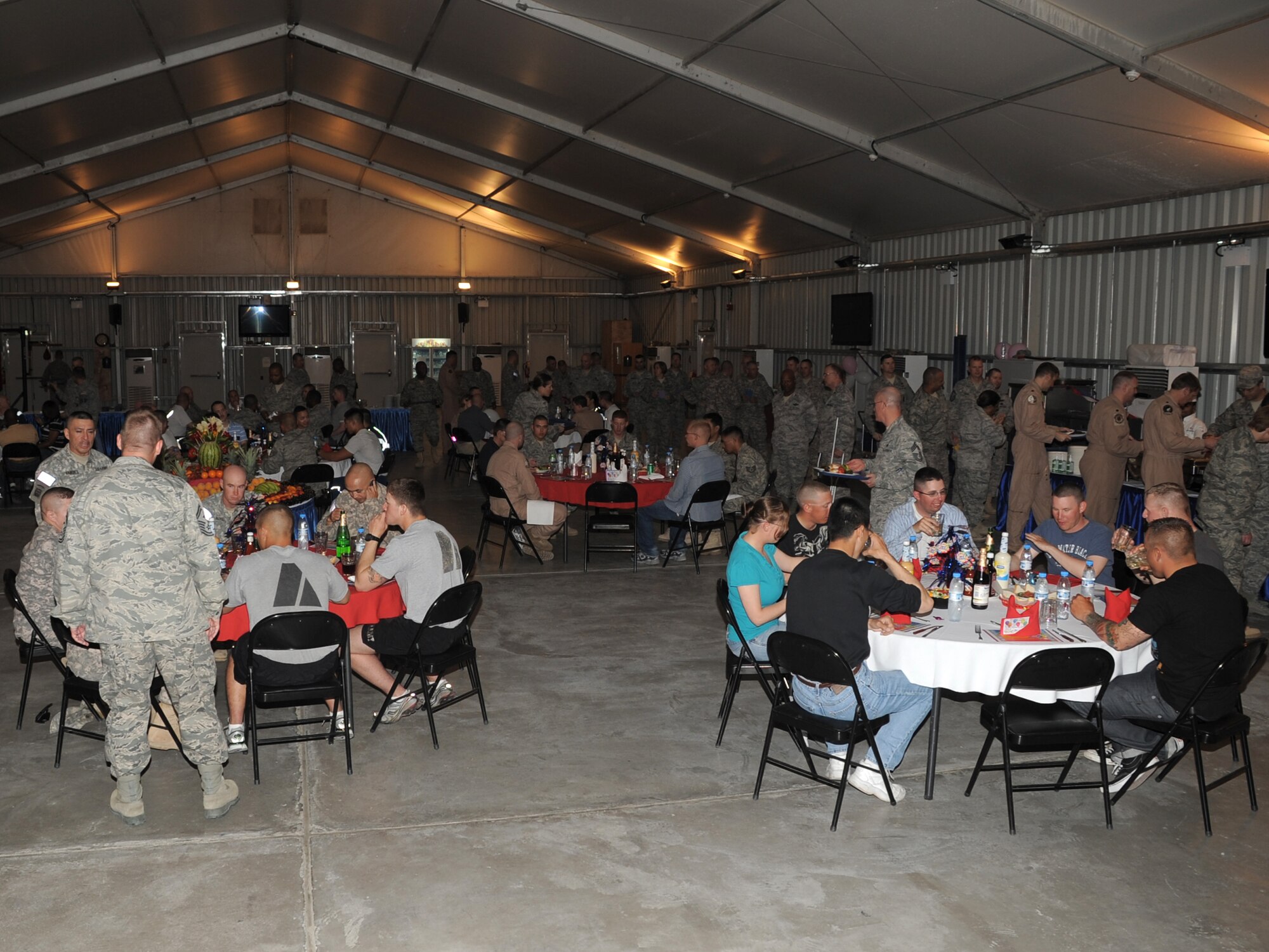 Members of the 380th Air Expeditionary Wing with birthdays occuring in the month of Feb. celebrate at the birthday dinner at an undisclosed location in Southwest Asia on Feb 16, 2010. Members of the wing are treated to a special meal served by the leadership and are given the opportunity to win door prizes and celebrate their birthday while deployed. The 380th AEW is comprised of four groups and 12 squadrons and the wing's deployed mission includes air refueling, surveillance, and reconnaissance in support of overseas contingency operations in Southwest Asia. The wing supports Operation Iraqi Freedom, Operation Enduring Freedom and the Combined Joint Task Force-Horn of Africa. (U.S. Air Force photo/Senior Airman Jenifer H. Calhoun/Released)
