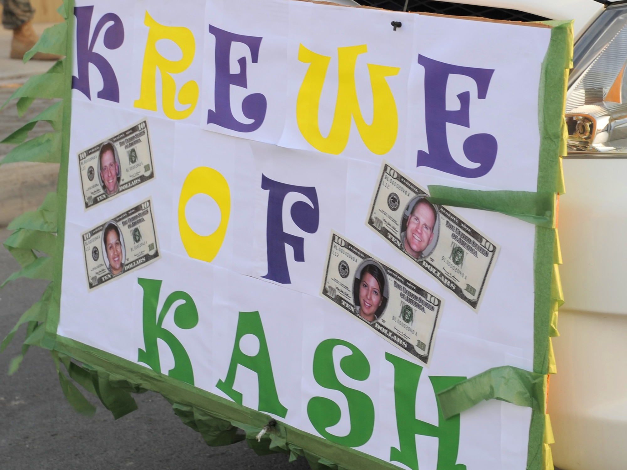 "Krewe of Kash" or 380th Air Expeditionary Wing Comptroller Squadron, displays their prize winning float during the 380th Air Expeditionary Wing Mardi Gras parade at an undisclosed location in Southwest Asia on Feb 16, 2010. The wing celebrated the holiday with a parade and cajun meal options at the dining facility.  The 380th AEW is comprised of four groups and 12 squadrons and the wing's deployed mission includes air refueling, surveillance, and reconnaissance in support of overseas contingency operations in Southwest Asia. The wing supports Operation Iraqi Freedom, Operation Enduring Freedom and the Combined Joint Task Force-Horn of Africa. (U.S. Air Force photo/Senior Airman Jenifer H. Calhoun/Released)
