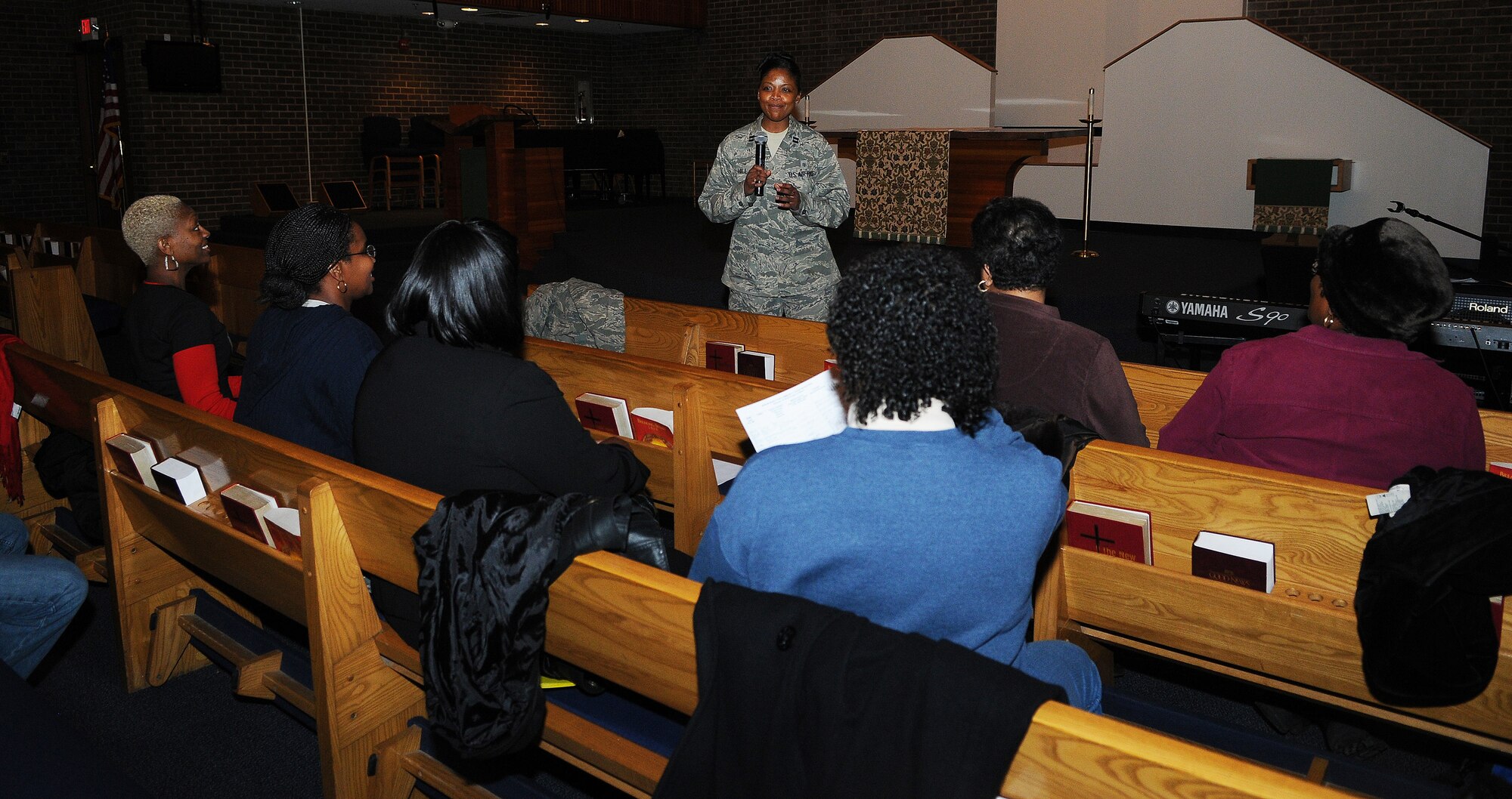 Capt. Theodosia Hill speaks during choir rehearsal Feb. 12 in the Bolling Main Chapel. Active duty, veterans, retirees and dependents from the Bolling Choir, Andrews Choir and Naval Air Station Patuxent River came together to form the joint choir that will be featured on a special “4Troops” patriotic album, consisting of patriotic pop and country songs. Its purpose is to bring more awareness about the military and deployed servicemembers. (U.S. Air Force photo by Airman 1st Class Katherine Windish) 