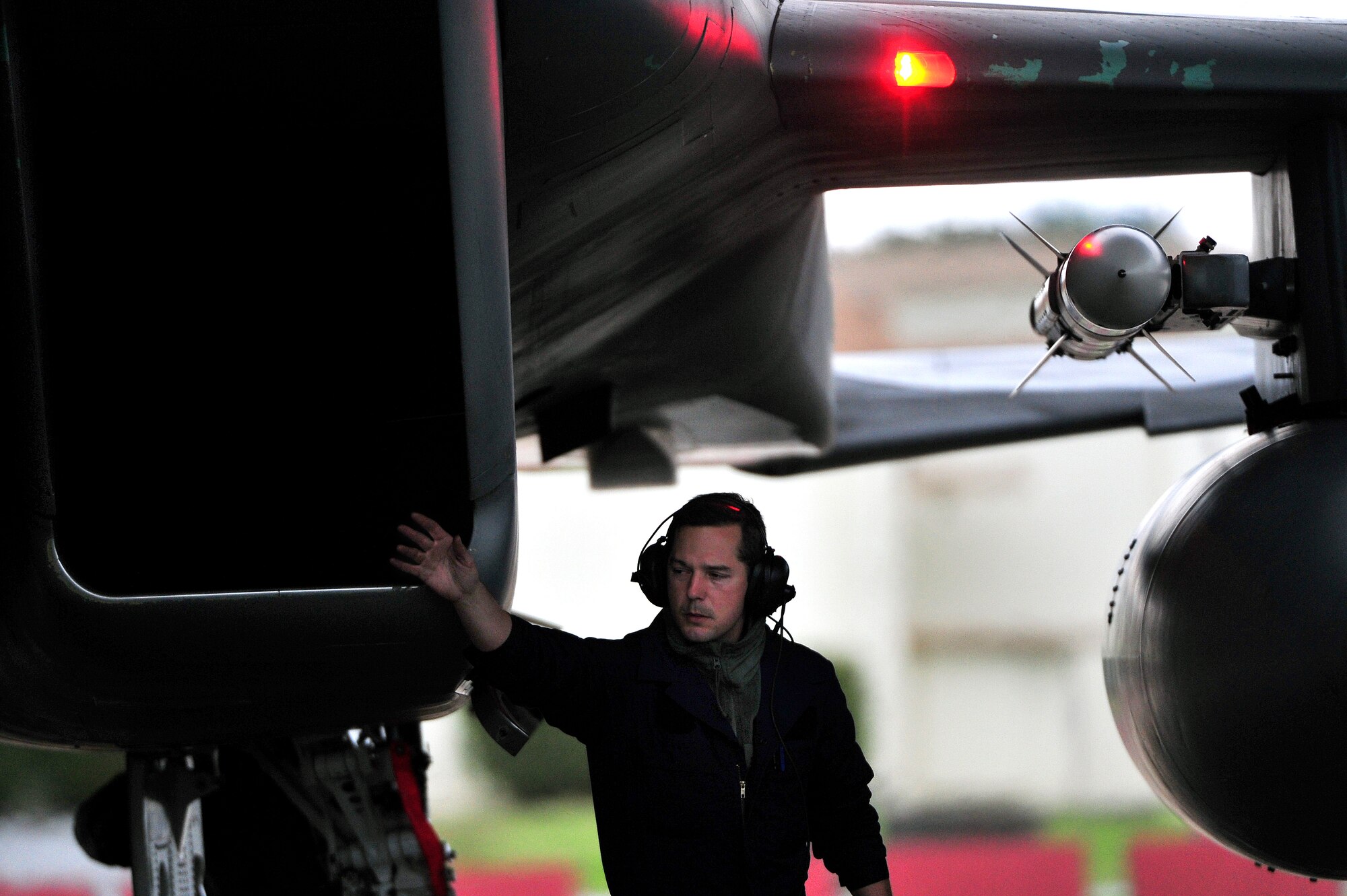 A crew chief (?) verifies that the F-15 flown home by Lt. Col Brian Farrar, 44th Fighter Squadron commander, is completely shut down. The 44th FS returned to Kadena Air Base, Japan, Feb. 18, from Red Flag 10-2, a 10-day aerial combat exercise at Nellis Air Force Base, Nev. While there, the pilots and the maintenance crews worked day and night to complete 128 sorties and amass 260 hours of flying time. 
(U.S. Air Force photo/Tech. Sgt. Rey Ramon)   
