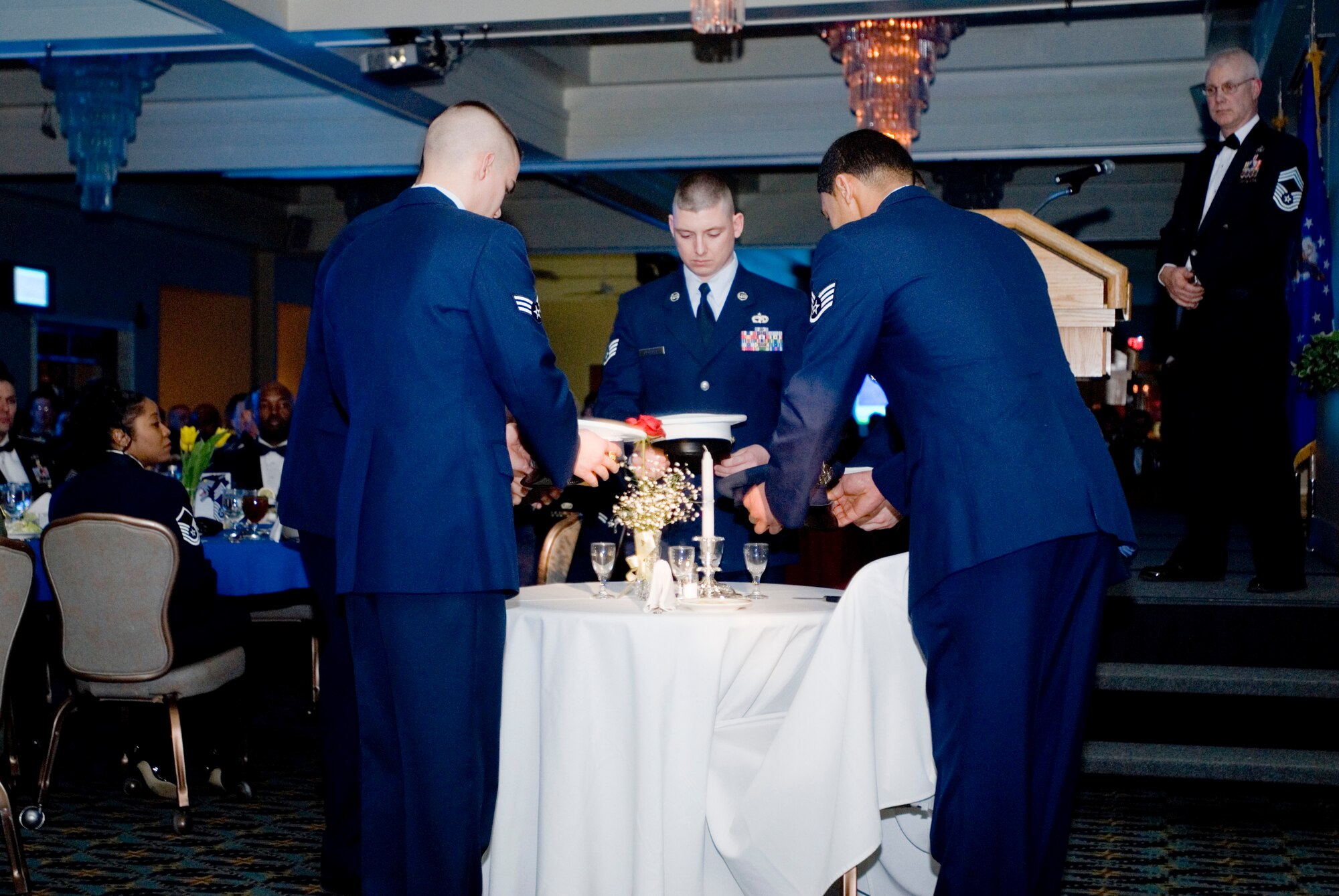 KUNSAN AIR BASE, Republic of Korea-Wolf Pack honor guards place hats honoring the combine services during a POW/MIA remembrance ceremony at the chief master sergeant induction ceremony, Feb. 13. The induction ceremony was to celebrate and recognize the four new Chiefs being promoted in the Wolf Pack. (U.S. Air Force photo/Senior Airman Jonathan Steffen)
