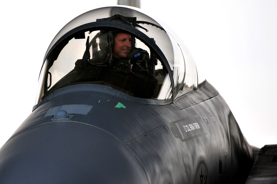 Lt. Col. Brian Farrar, 44th Fighter Squadron commander, and members of his squadron return to Kadena Air Base, Japan, Feb. 18, from Red Flag 10-2, a 10-day aerial combat exercise held at Nellis Air Force Base, Nev. The pilots and maintenance crews worked day and night to complete 128 sorties and amass 260 hours of flying time. (U.S. Air Force photo/Tech. Sgt. Rey Ramon) 