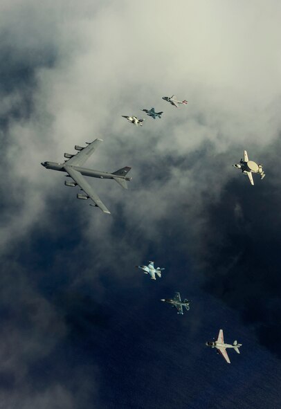 A U.S. Air Force B-52 Stratofortress from the 20th Expeditionary Bomb Squadron, Barksdale Air Force Base, La., leads a formation of two F-16 Fighting Falcons from the 18th Aggressor Squadron, Eielson AFB, Alaska, two Japan Air Self-Defense Force F-2 attack fighters from the 6th Tactical Fighter Squadron, Tsuiki AB, Japan, two U.S. Navy EA-6B Prowlers from Electronic Attack Squadron (VAQ) 136, Carrier Air Wing Five, Naval Air Facility, Atsugi, Japan, and an E-2C Hawkeye from 601st Squadron, Misawa Air Base, Japan, over Guam during Exercise Cope North, Feb. 15, 2010. The United States Air Force and the Japan Air Self-Defense Force conduct Cope North annually at Andersen Air Force Base to increase combat readiness and interoperability, concentrating on coordination and evaluation of air tactics, techniques and procedures. The ability for both nations to work together increases their preparedness to support real-world contingencies.  (U.S. Air Force photo by Staff Sgt. Jacob N. Bailey / Released)