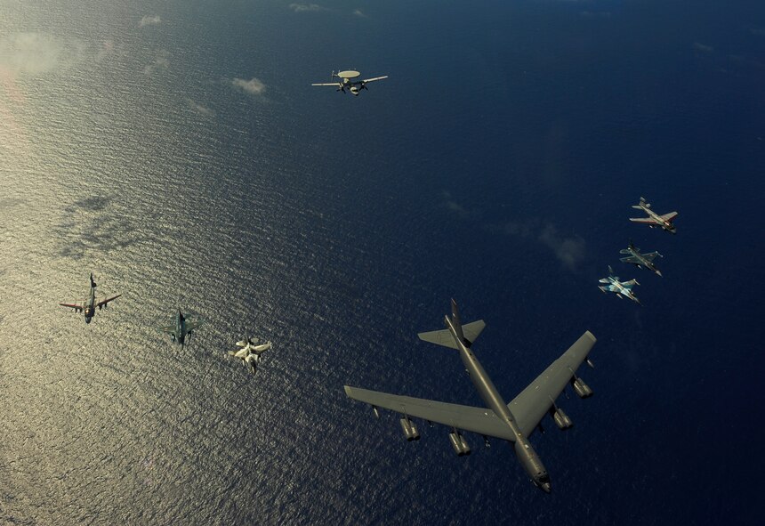 A U.S. Air Force B-52 Stratofortress from the 20th Expeditionary Bomb Squadron, Barksdale Air Force Base, La., leads a formation of two F-16 Fighting Falcons from the 18th Aggressor Squadron, Eielson AFB, Alaska, two Japan Air Self-Defense Force F-2 attack fighters from the 6th Tactical Fighter Squadron, Tsuiki AB, Japan, two U.S. Navy EA-6B Prowlers from Electronic Attack Squadron (VAQ) 136, Carrier Air Wing Five, Naval Air Facility, Atsugi, Japan, and an E-2C Hawkeye from 601st Squadron, Misawa Air Base, Japan, near Guam during Exercise Cope North, Feb. 15, 2010. The United States Air Force and the Japan Air Self-Defense Force conduct Cope North annually at Andersen Air Force Base to increase combat readiness and interoperability, concentrating on coordination and evaluation of air tactics, techniques and procedures. The ability for both nations to work together increases their preparedness to support real-world contingencies.  (U.S. Air Force photo by Staff Sgt. Jacob N. Bailey / Released)