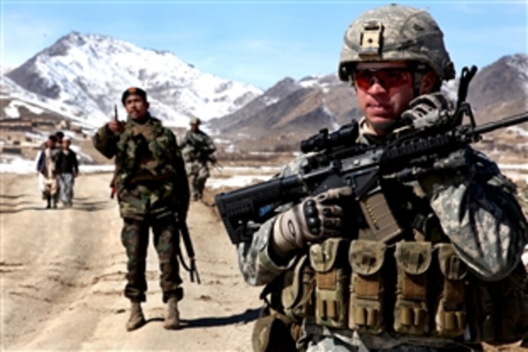 A U.S. Army soldier patrols with Afghan soldiers to check on conditions in the village of Yawez in Wardak province, Afghanistan, Feb. 17, 2010. The partnership between U.S. and Afghan soldiers is proving to be a valuable tool in bringing security to the area. The U.S. soldiers are assigned to Company A, 1st Battalion, 503rd Infantry Regiment, 173rd Airborne Brigade Combat Team.