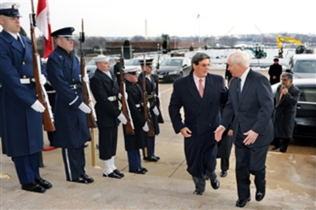 Secretary of Defense Robert M. Gates (right) escorts Peruvian Minister of Defense Rafael Rey through an honor cordon and into the Pentagon on Feb. 17, 2010.  Gates and Rey will hold security discussions on a range of mainly regional issues.  