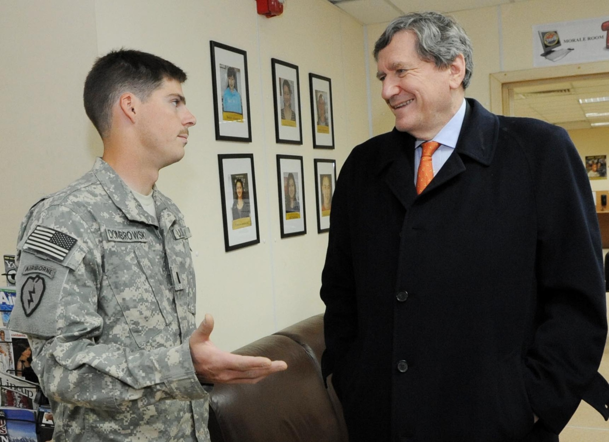 U.S. Army 1st Lt. Zachary Dombrowski speaks with U.S. Special Representative for Afghanistan and Pakistan, Ambassador Richard Holbrooke, about his deployment to Afghanistan at the Transit Center at Manas, Kyrgyzstan, Feb. 19, 2010. Lieutenant Dombrowski is transiting through on his way back to his home unit, Dog Company 3-509, Fort Richardson, Alaska. (U.S. Air Force photo/Senior Airman Nichelle Anderson/released). 
