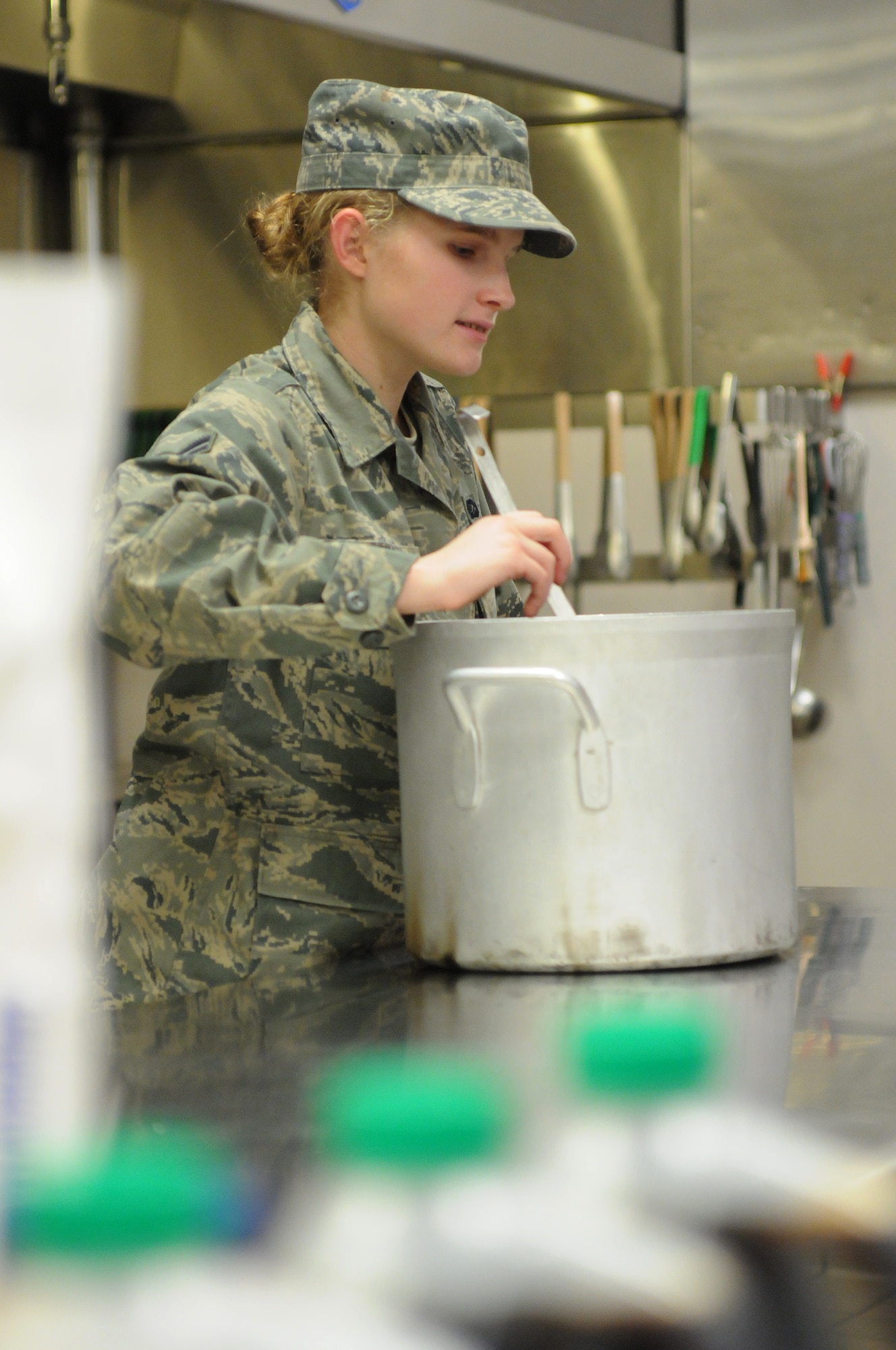 FAIRCHILD AIR FORCE BASE, Wash. – Airman 1st Class Mara Ewing prepares food in the Warrior Dining Facility on Feb. 6. (U.S. Air Force photo / Staff. Sgt. Anthony Ennamorato)