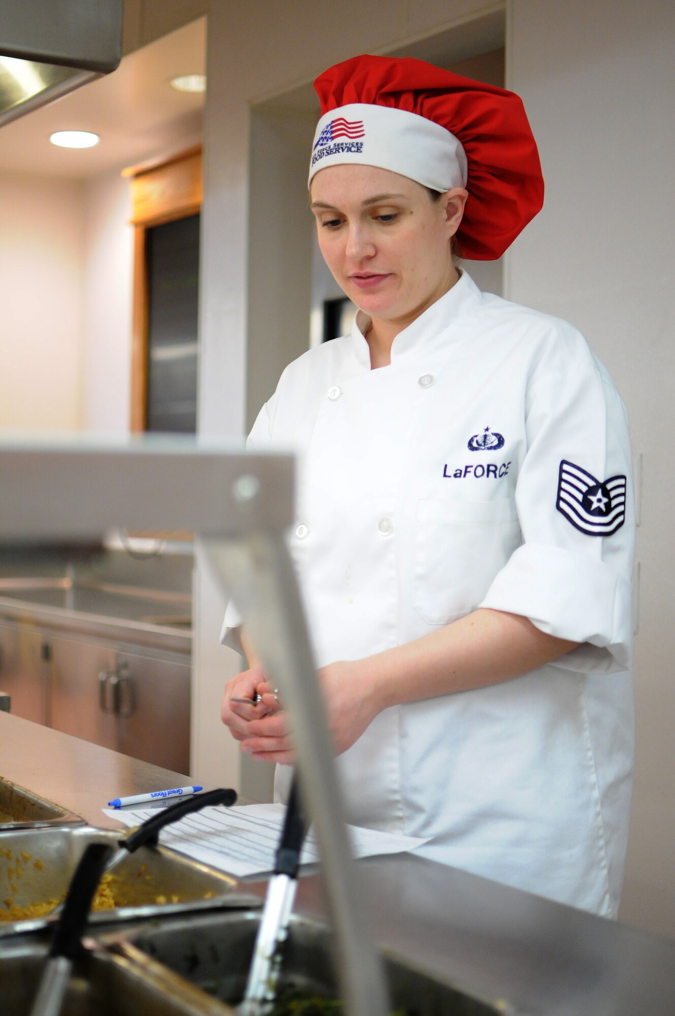 FAIRCHILD AIR FORCE BASE, Wash. – Tech. Sgt. Cynthia LaForce tests food temperature in the Warrior Dining Facility on Feb. 6. (U.S. Air Force photo / Staff. Sgt. Anthony Ennamorato)