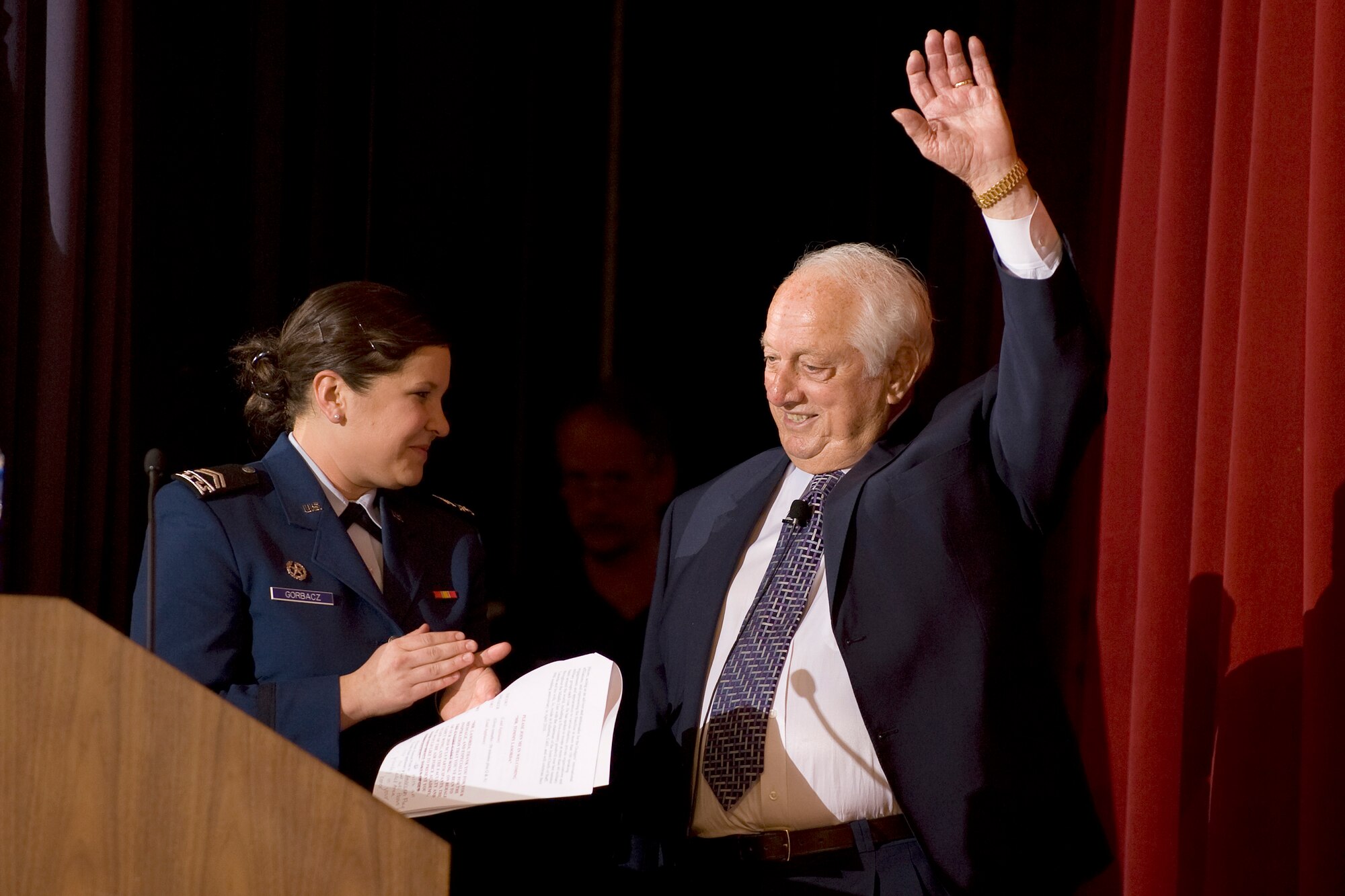 Tommy Lasorda, former LA Dodgers manager, is introduced by Cadet 2nd Class Katie Gorbacz to cadets Feb. 18, 2010, during a keynote session at the 17th-annual National Character and Leadership Symposium at the U.S. Air Force Academy. This annual event continues to be regarded as one of the premier national symposiums in the area of character development, designed to guide cadets toward turning ethical reasoning into action, improving knowledge of ethics and foundations of character, and developing a sense of moral courage. Cadet Gorbacz is assigned to Cadet Squadron 11. (U.S. Air Force photo/Bill Evans)