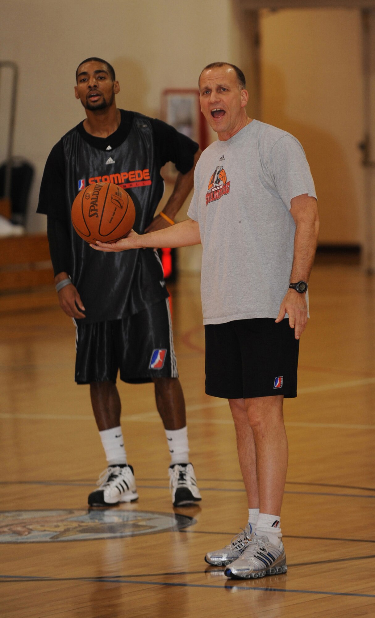 MOUNTAIN HOME AIR FORCE BASE, Idaho -- Robert MacKinnon, Idaho Stampede head coach, explains a play during practice Feb. 18 held at the base fitness center. The Idaho Stampede players were at Mountain Home in support of Air Power Night and show their support for the Gunfighters.  The Idaho Stampede is a member of the NBA Development League with its base of operations in Boise, Idaho. (U.S. Air Force photo by Airman 1st Class Renishia Richardson)